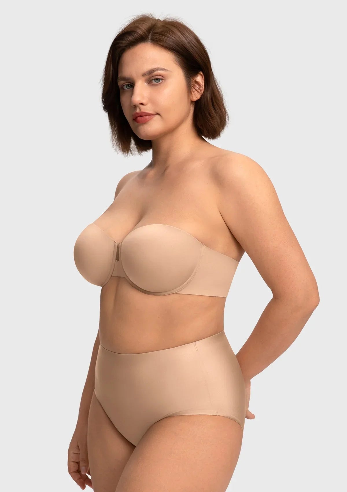 Side view of the almond skin supportive strapless bra, expertly tailored to embrace, center, and lift slightly pendulous shapes.