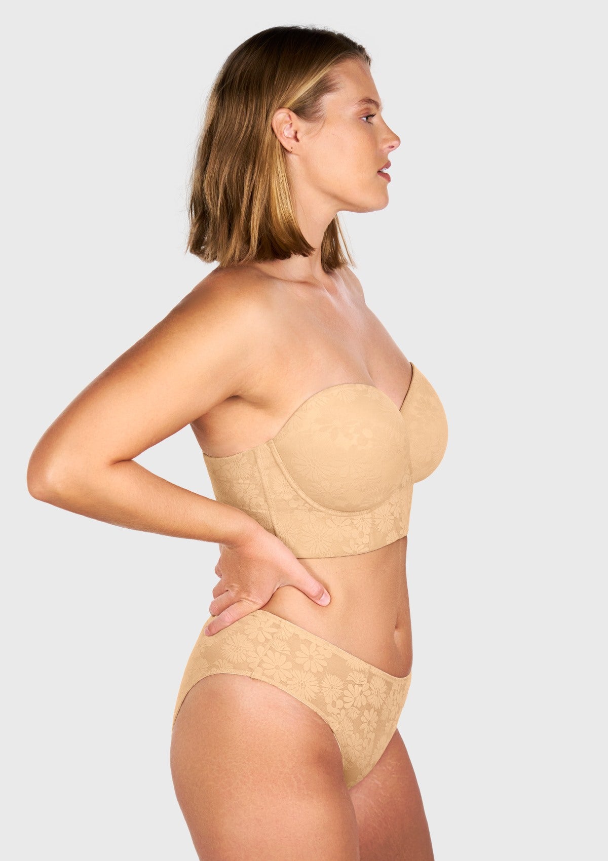 Side profile of the beige lightly padded balconette bra, showcasing the sturdy molded foam cups that effortlessly sculpt and uplift your curves.