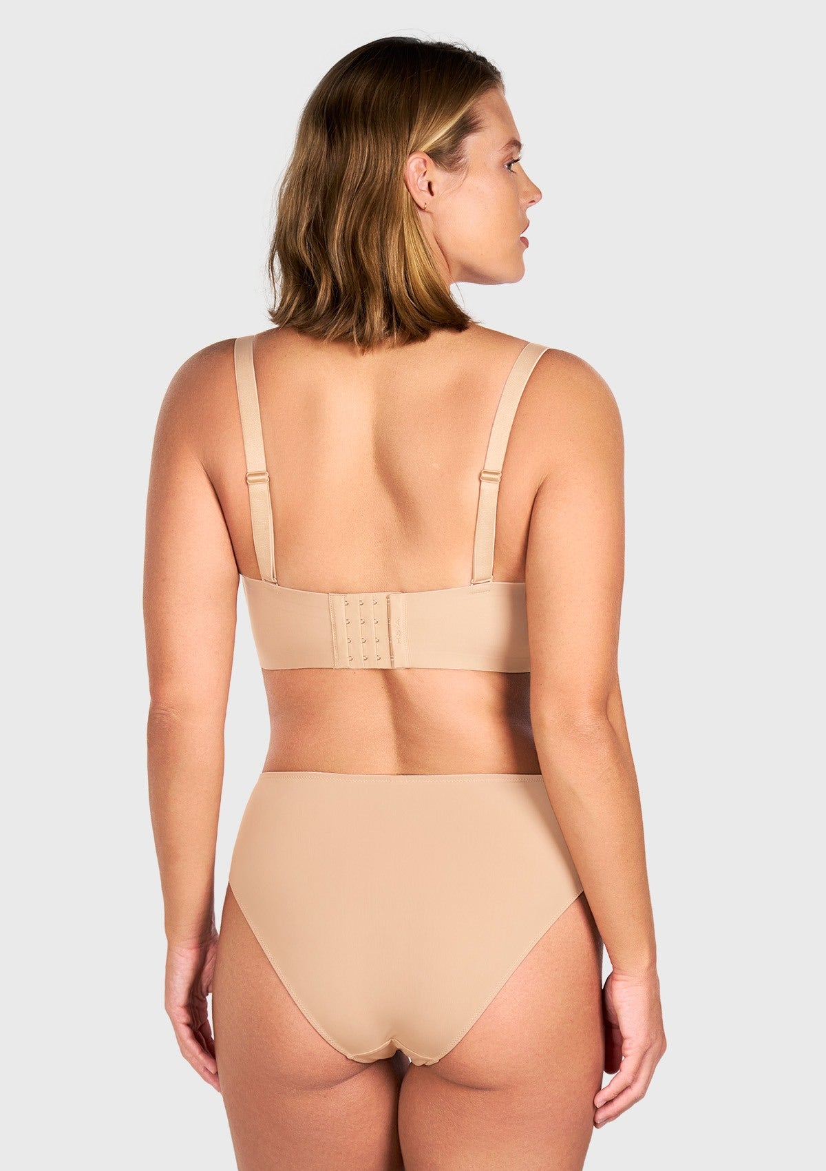 Back view of the black multiway strapless bra with straps attached