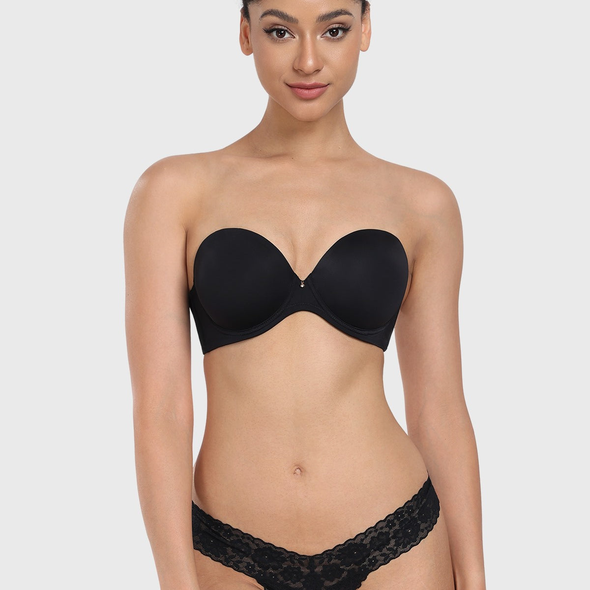 Front view of the black strapless bra, offering elegant lift and secure containment as the perfect bra for off the shoulder dress and evening wear.