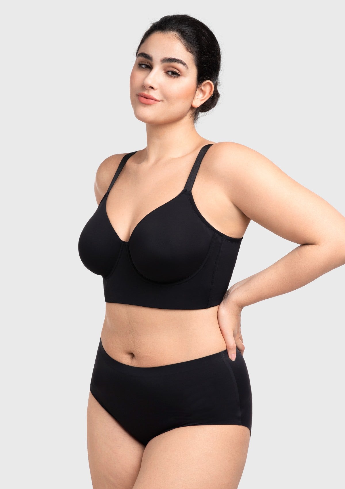 45-degree angle showing how the black full figure bra perfectly centers curves with built-in mesh side support