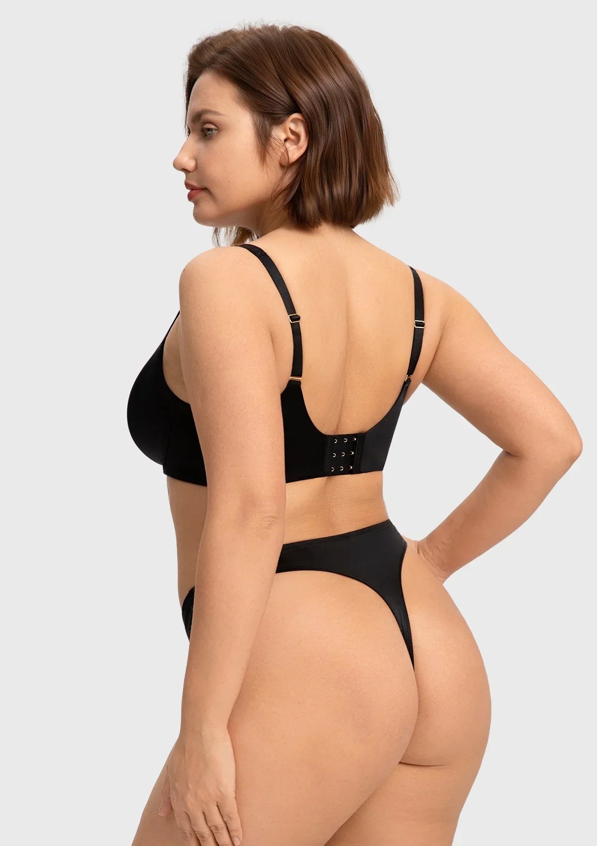 Back view of the black comfortable seamless bra, showcasing the customized hook closure and smoothing double-layered wings.