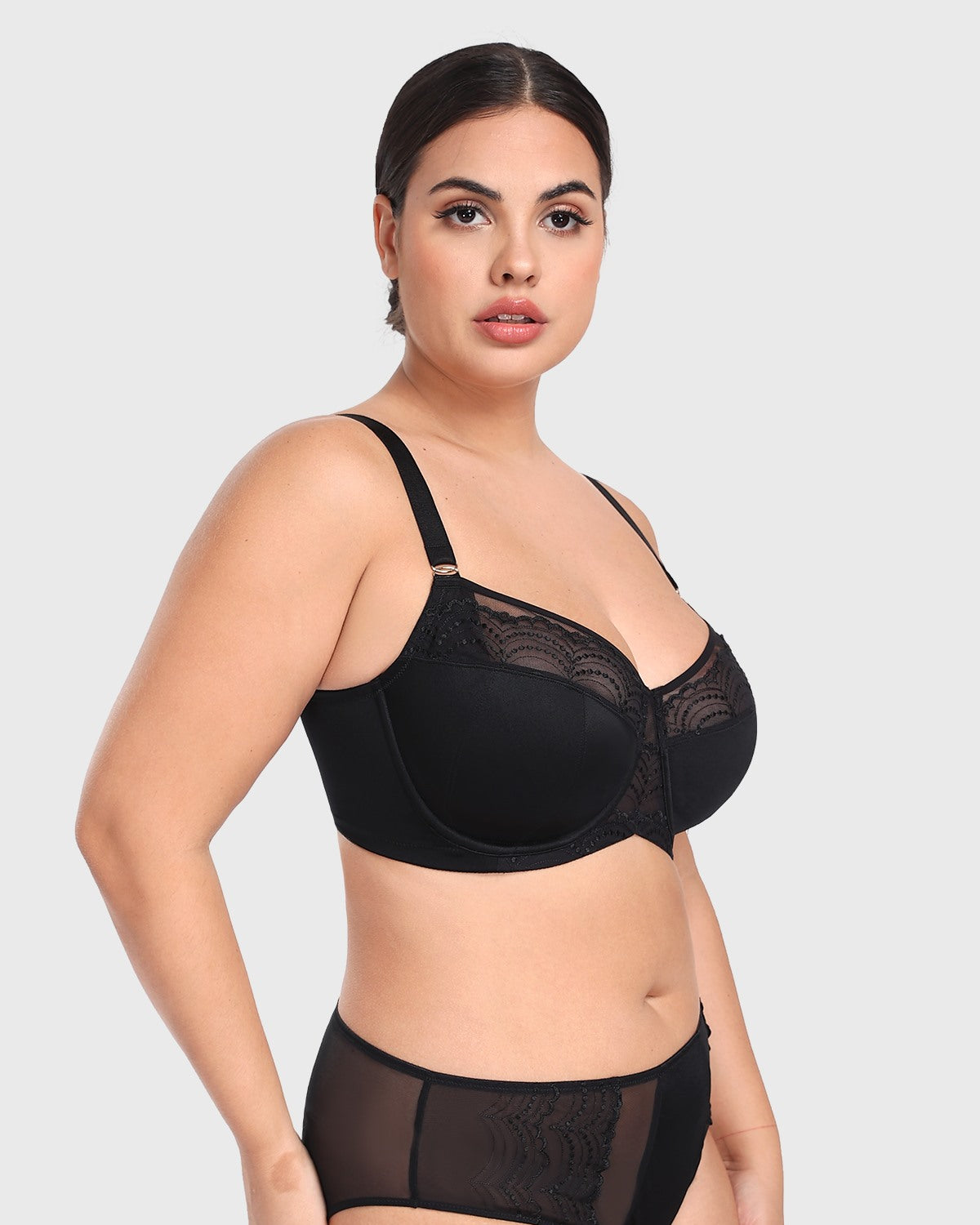 Three-quarter side profile of the black plus size balconette bra, expertly designed with multi-part cups to naturally center and shape heavy breasts.