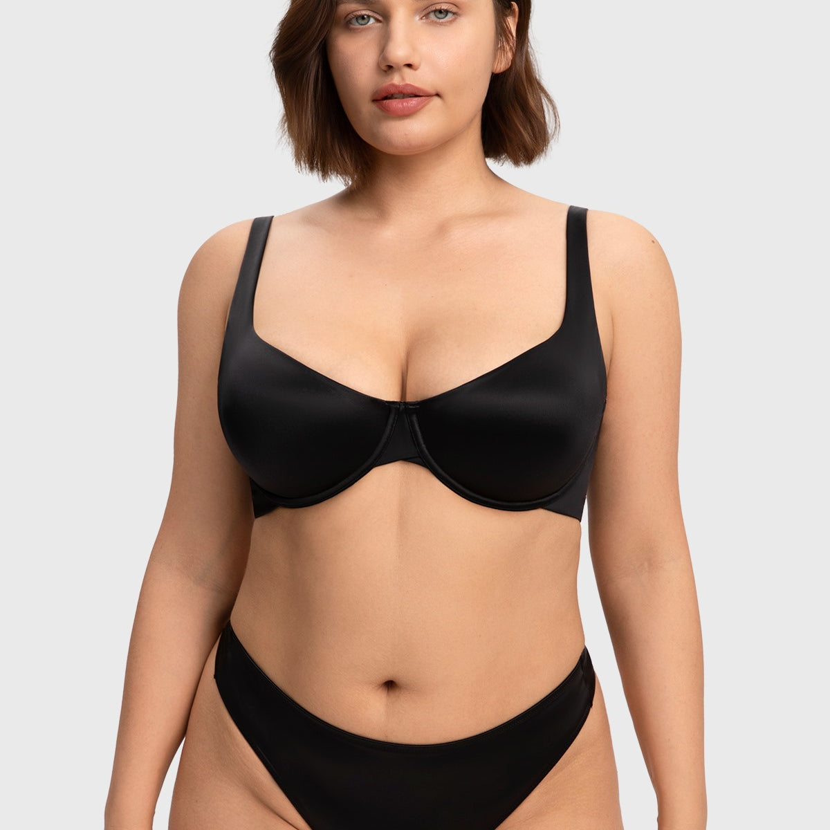 Front view of the black invisible unlined T-shirt bra, delivering an effortless second-skin feel and sleek support for A to DDD cups.