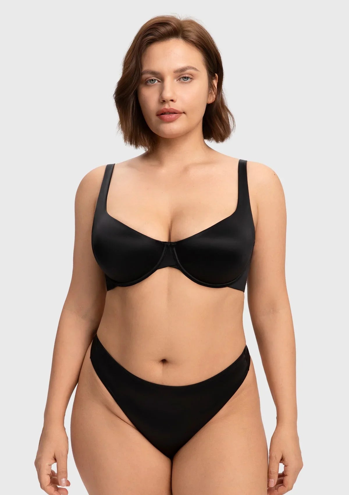 Front view of the black invisible unlined T-shirt bra, delivering an effortless second-skin feel and sleek support for A to DDD cups.