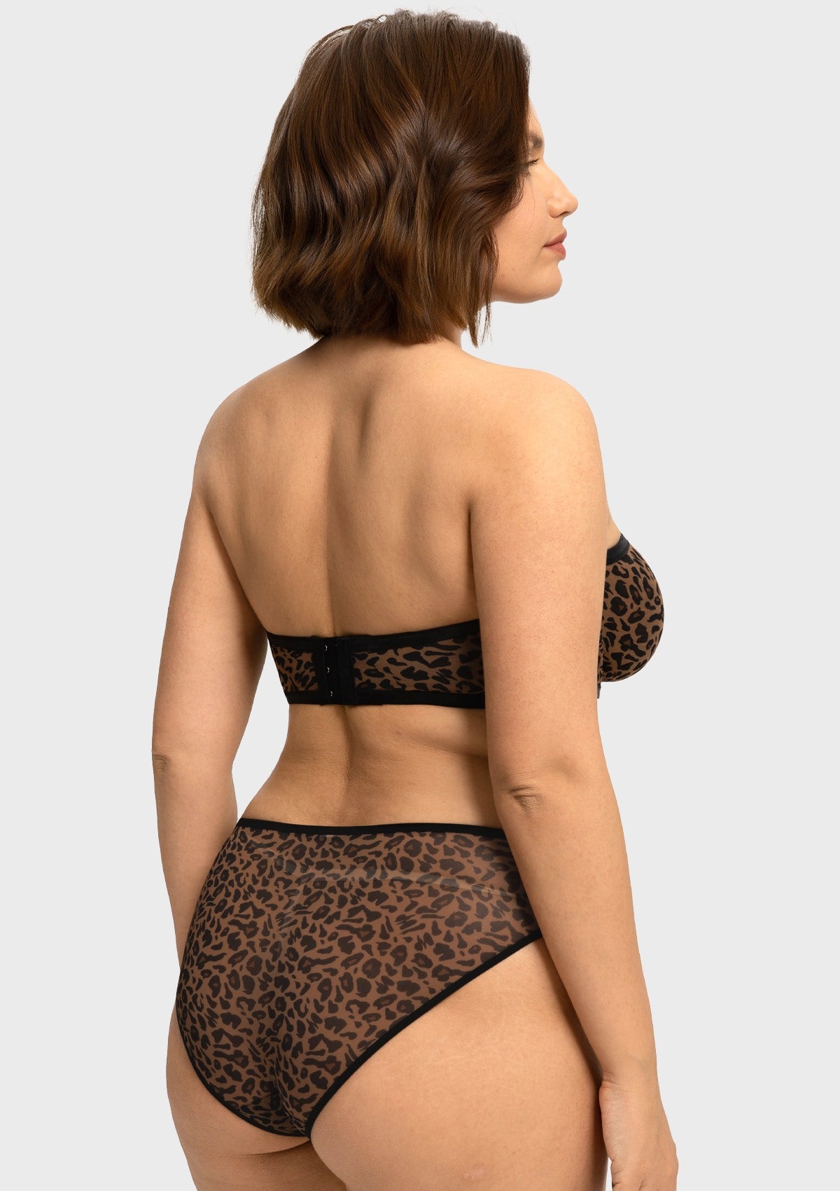 Back view of the black leopard strapless underwire bra showing the smoothing U-back band