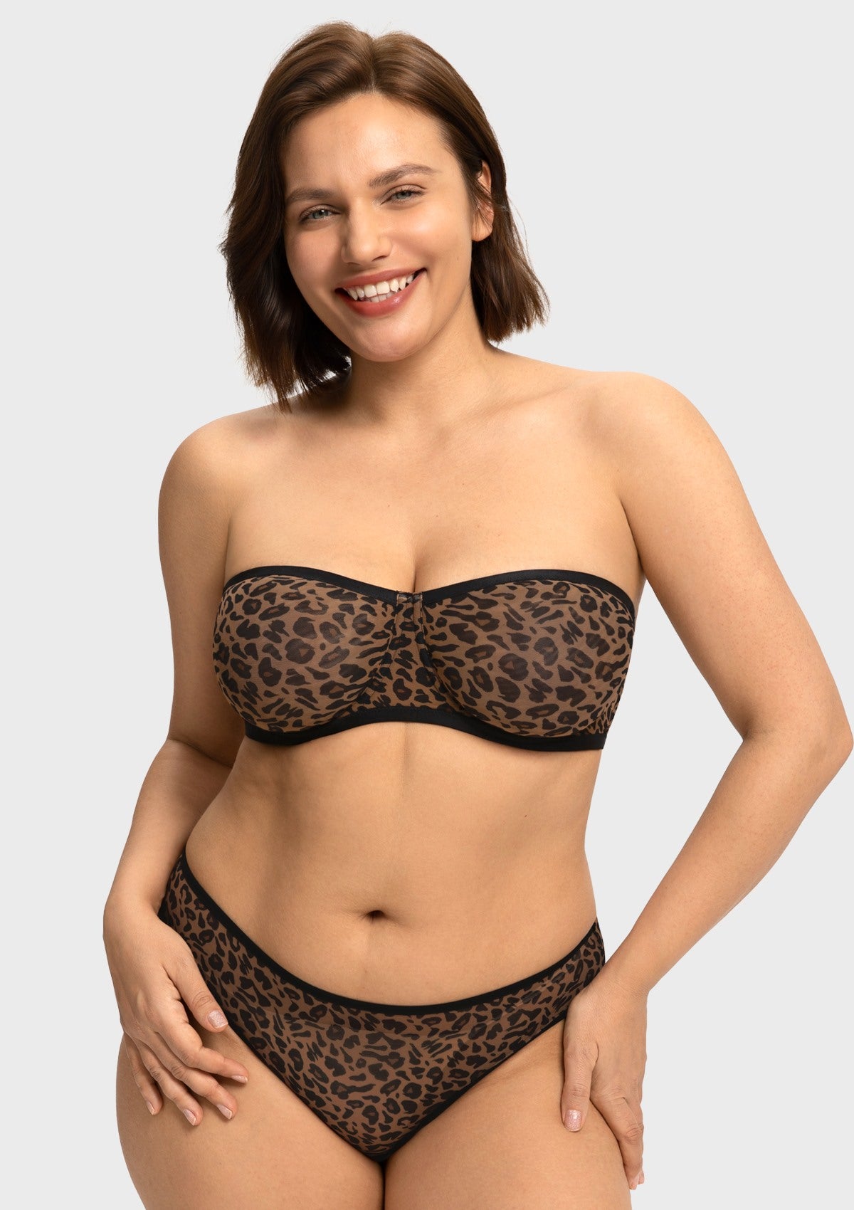 Front view of woman wearing the black leopard unlined strapless minimizer bra