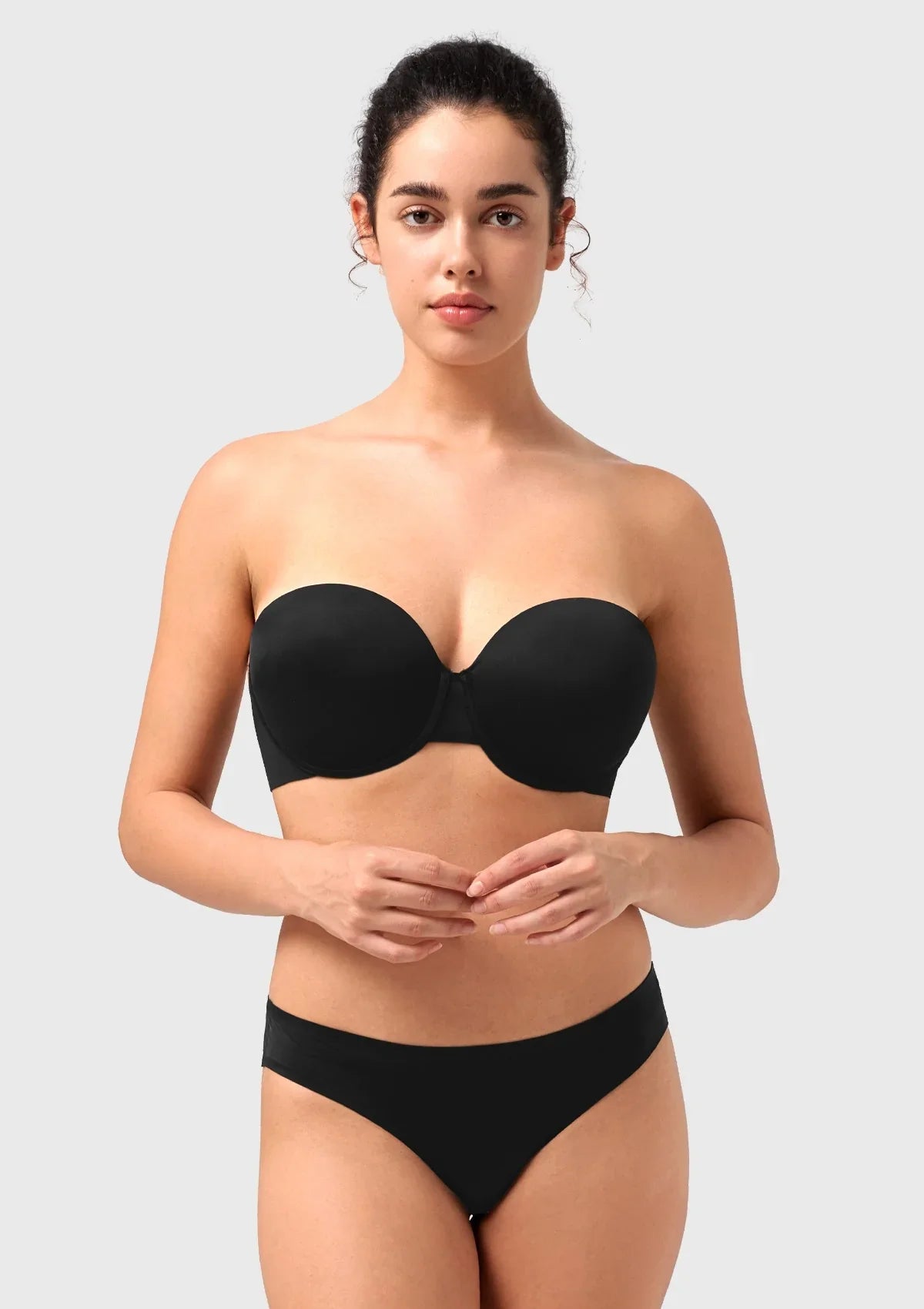 Front view of the black seamless push-up strapless bra, providing an elegant and invisible lift perfect for evening wear and party dresses.