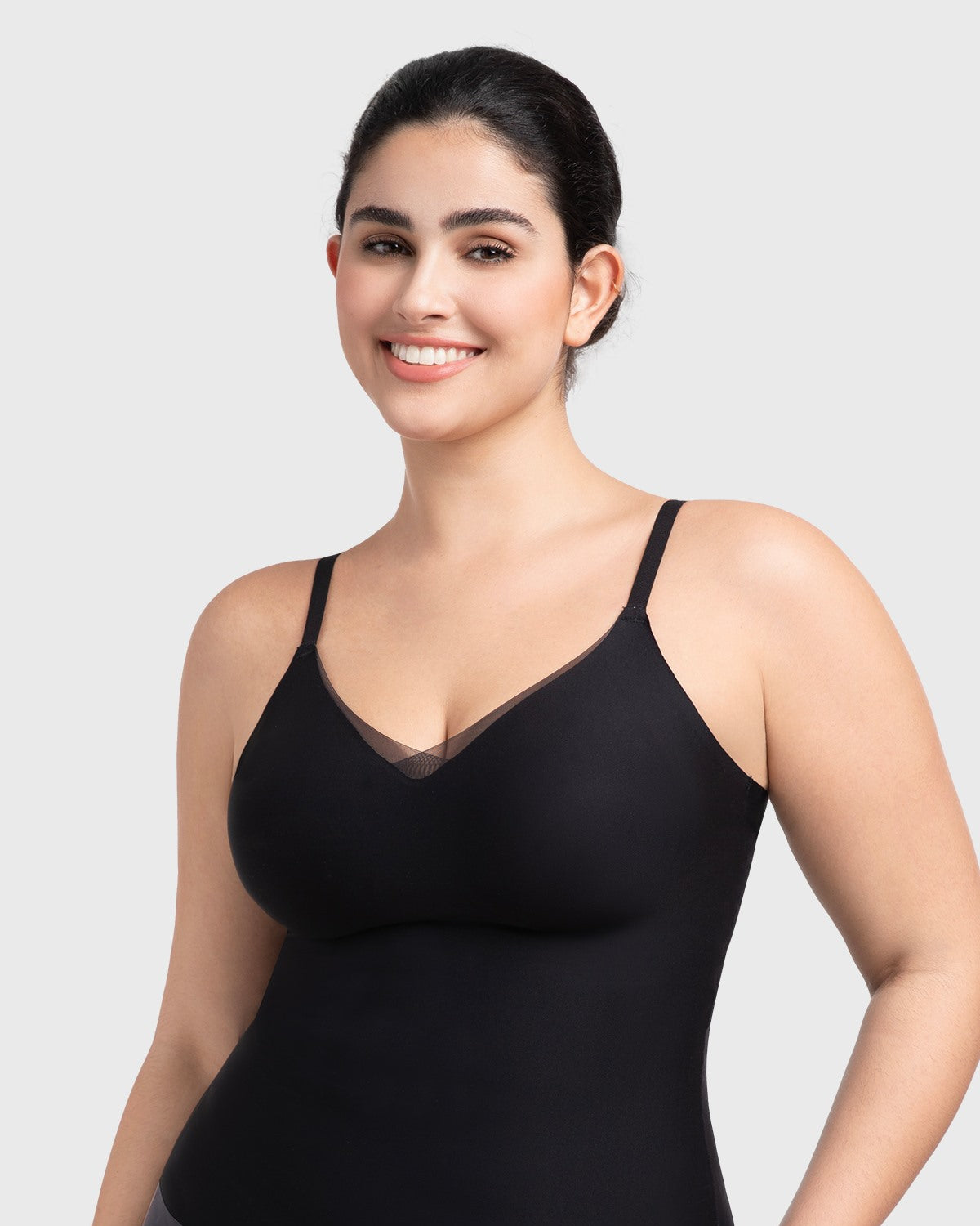 Front view of the black Silvia seamless padded bra top, showcasing the elegant sheer mesh V-neck and buttery-soft fabric.