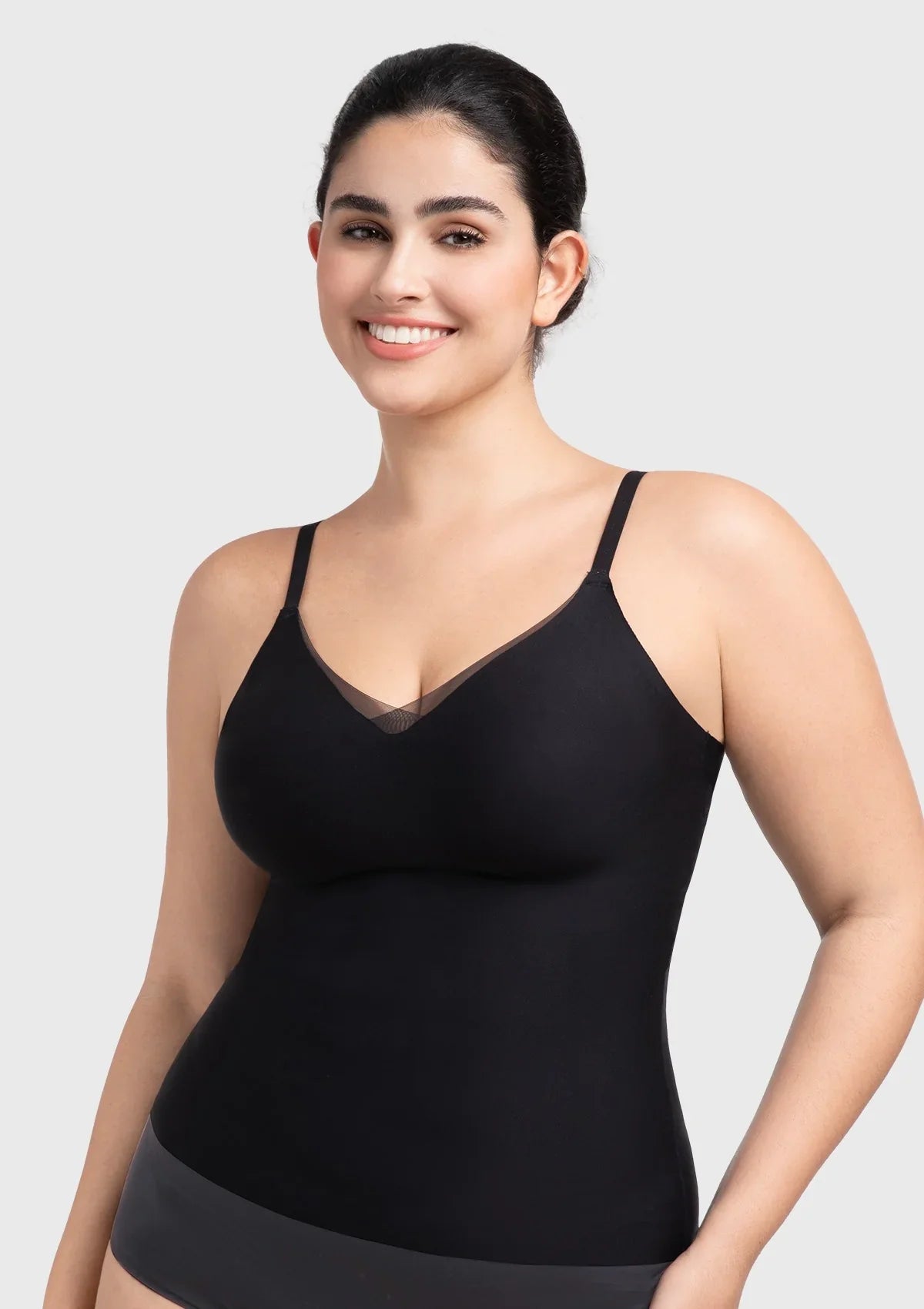 Front view of the black Silvia seamless padded bra top, showcasing the elegant sheer mesh V-neck and buttery-soft fabric.