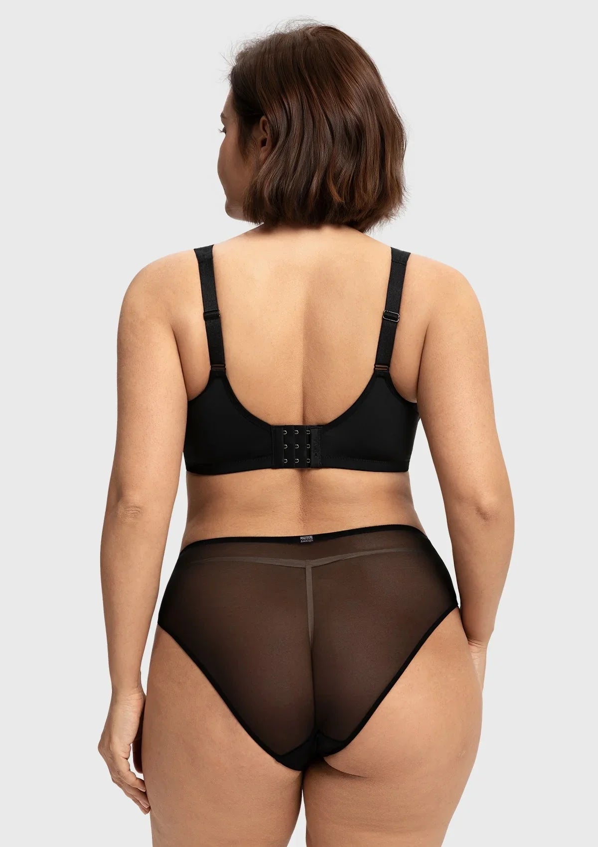 Back view of the black smoothing back full coverage bra, showcasing the secure multi-row hook closure that scales perfectly with your cup size.