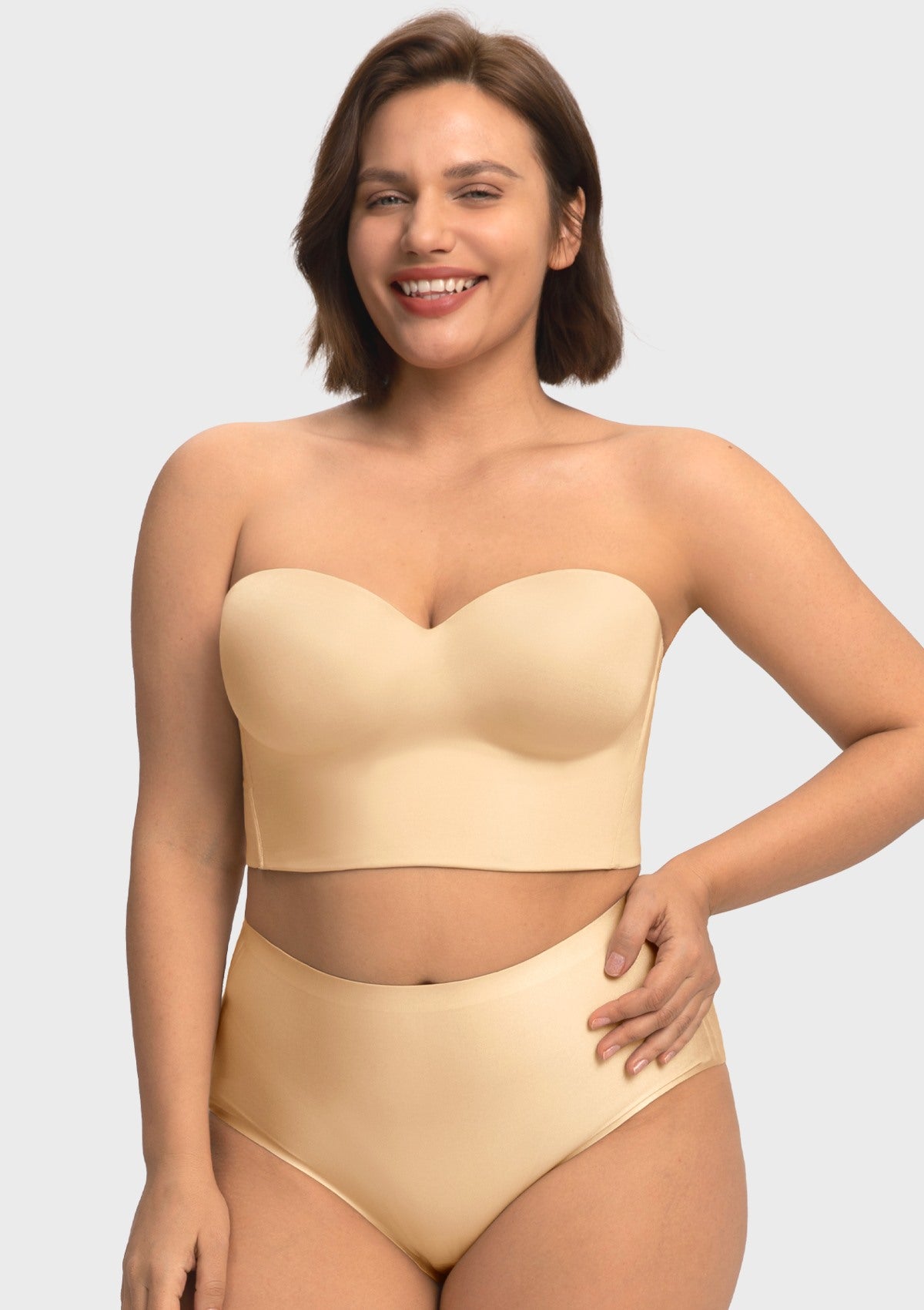 Smiling woman wearing the champagne supportive strapless corset bra, enjoying comfortable, gravity-defying lift for C to I cups.