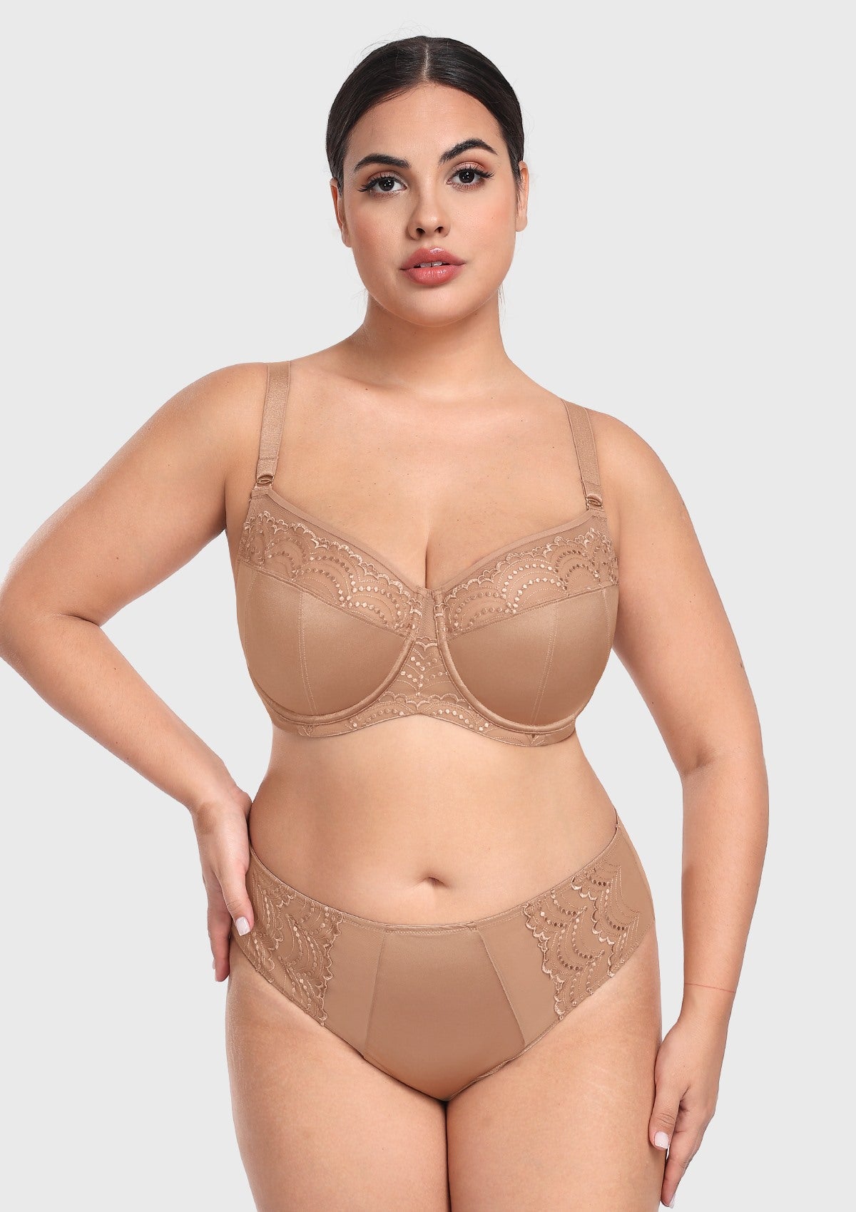 Confident woman with hands on hips wearing the dark beige unlined balconette bra, featuring a natural, rounded lift and perfect separation.