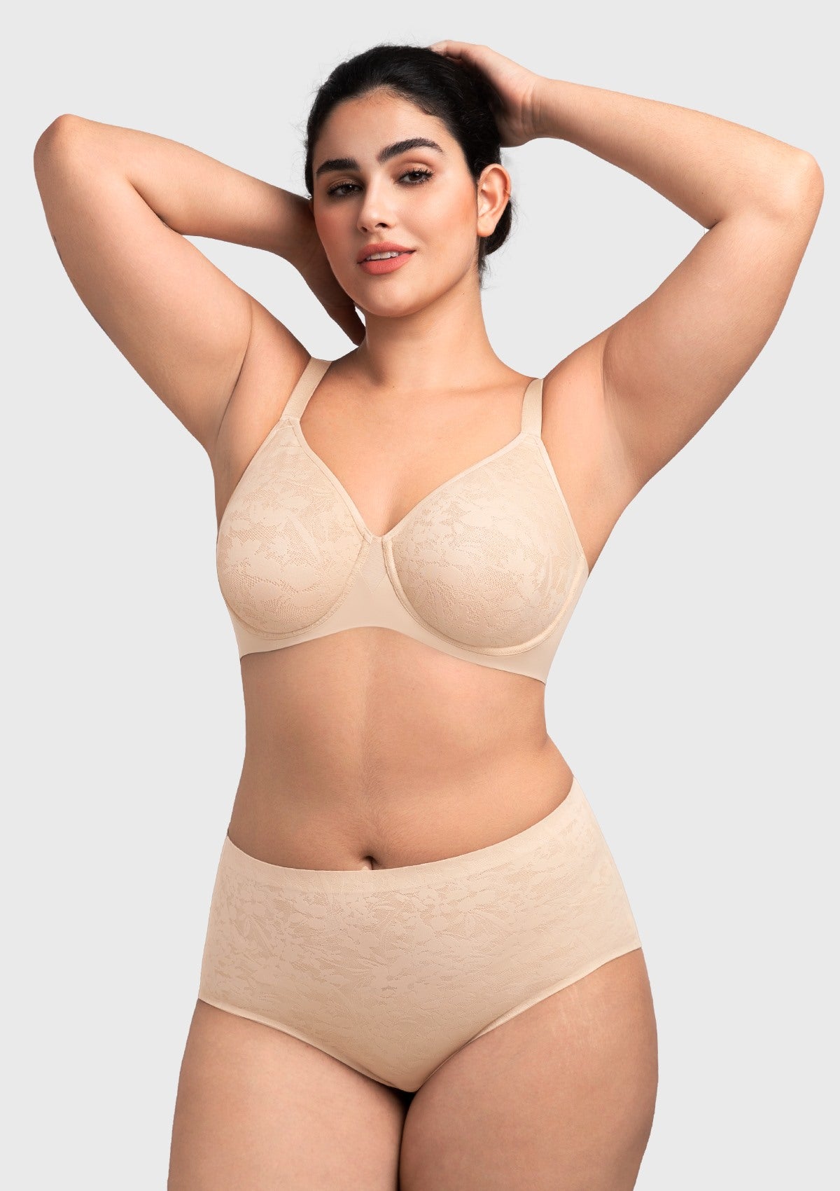 Woman raising her arms in the nude moisture-wicking lace bra, demonstrating secure, stay-put underwire support and breathable comfort.