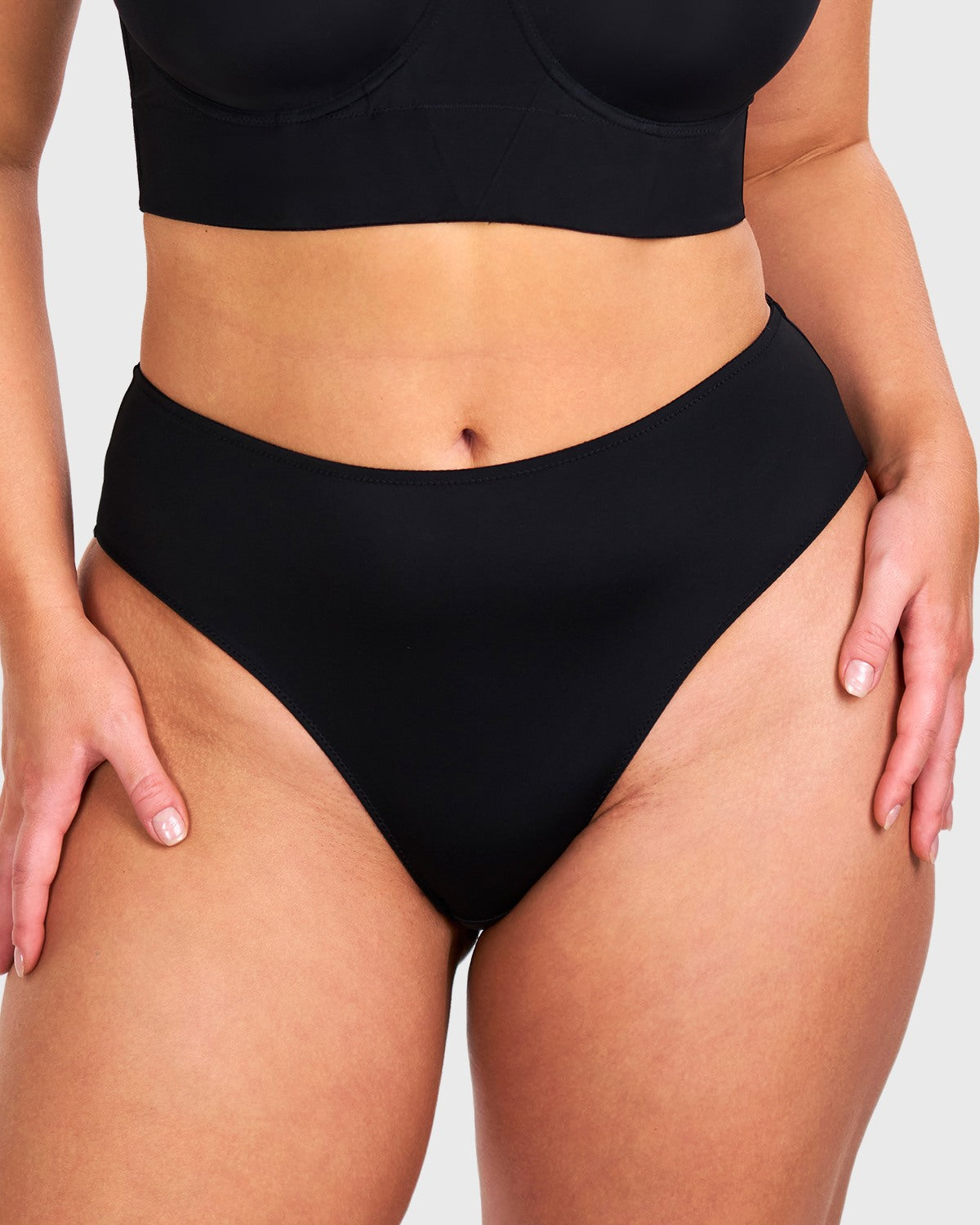 Front view of model wearing the HSIA black modern high brief panty, featuring super-soft microfiber and a flawless seamless high waist design.