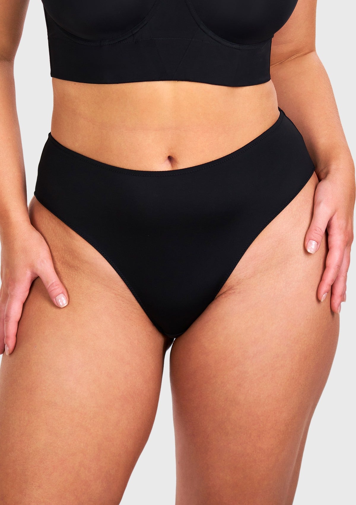 Front view of model wearing the HSIA black modern high brief panty, featuring super-soft microfiber and a flawless seamless high waist design.