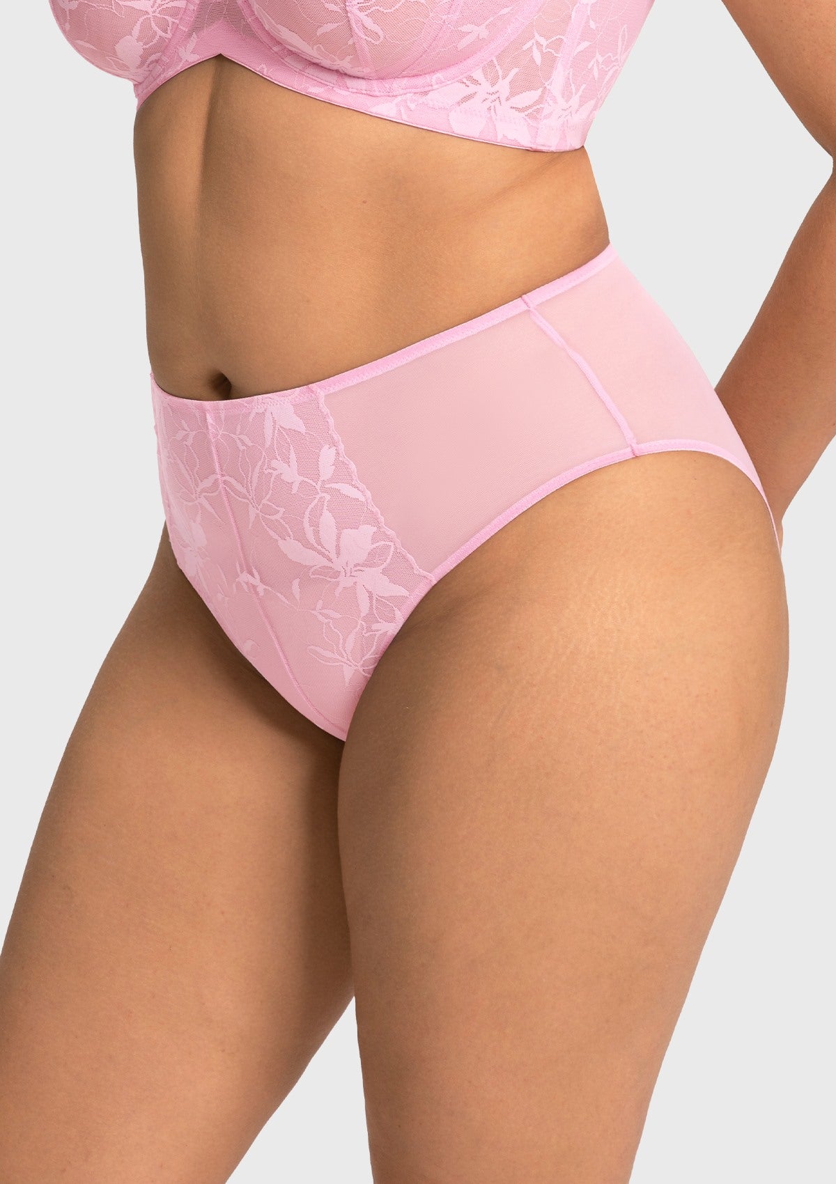 Side profile of model in the soft pink high waist lace panty, showcasing the high-quality elastic waist that never digs in.