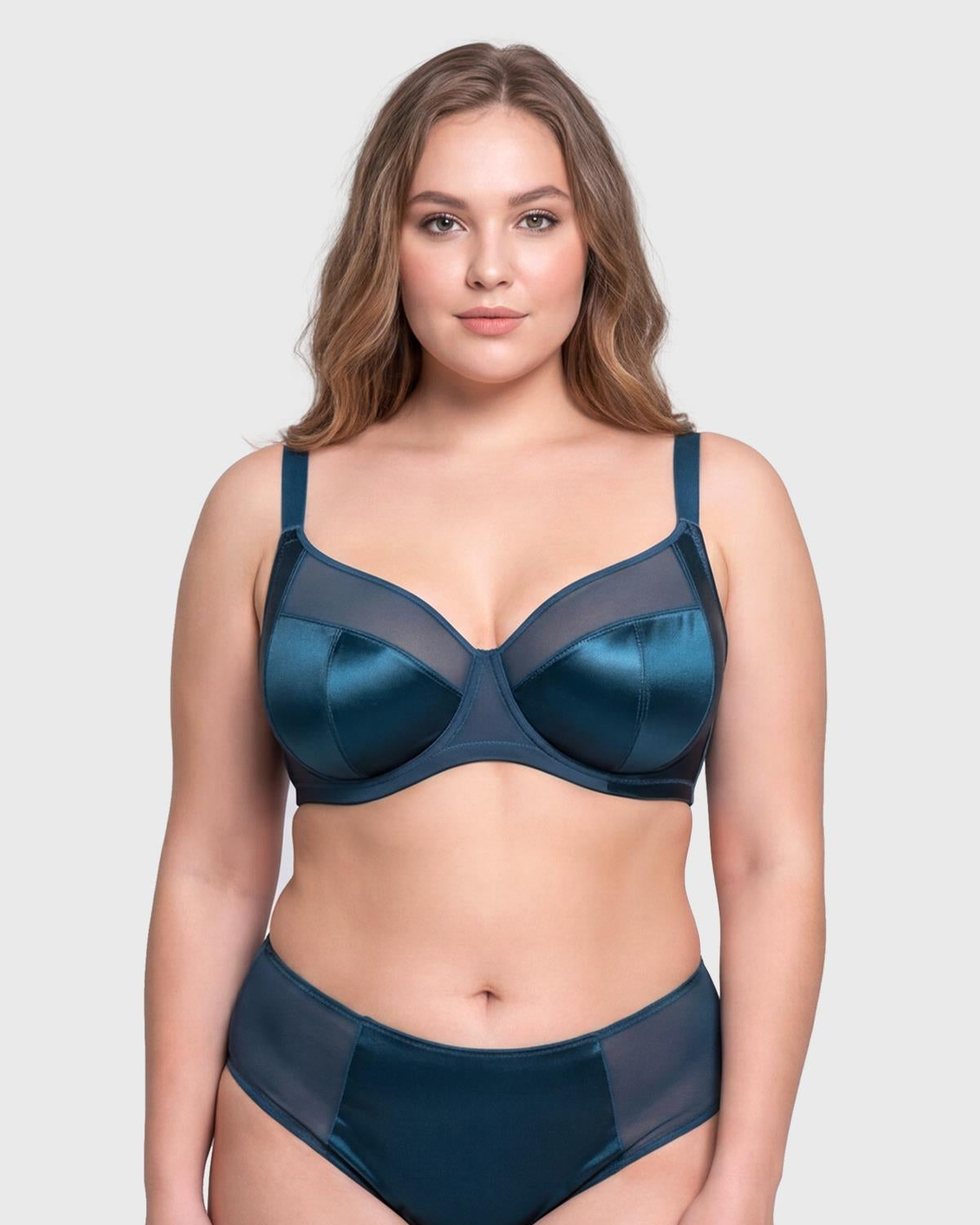 Front view of model wearing the vibrant Ocean Blue HSIA Lunaire shimmer unlined bra, featuring sensual sheer mesh and heavy-duty support up to L cup.