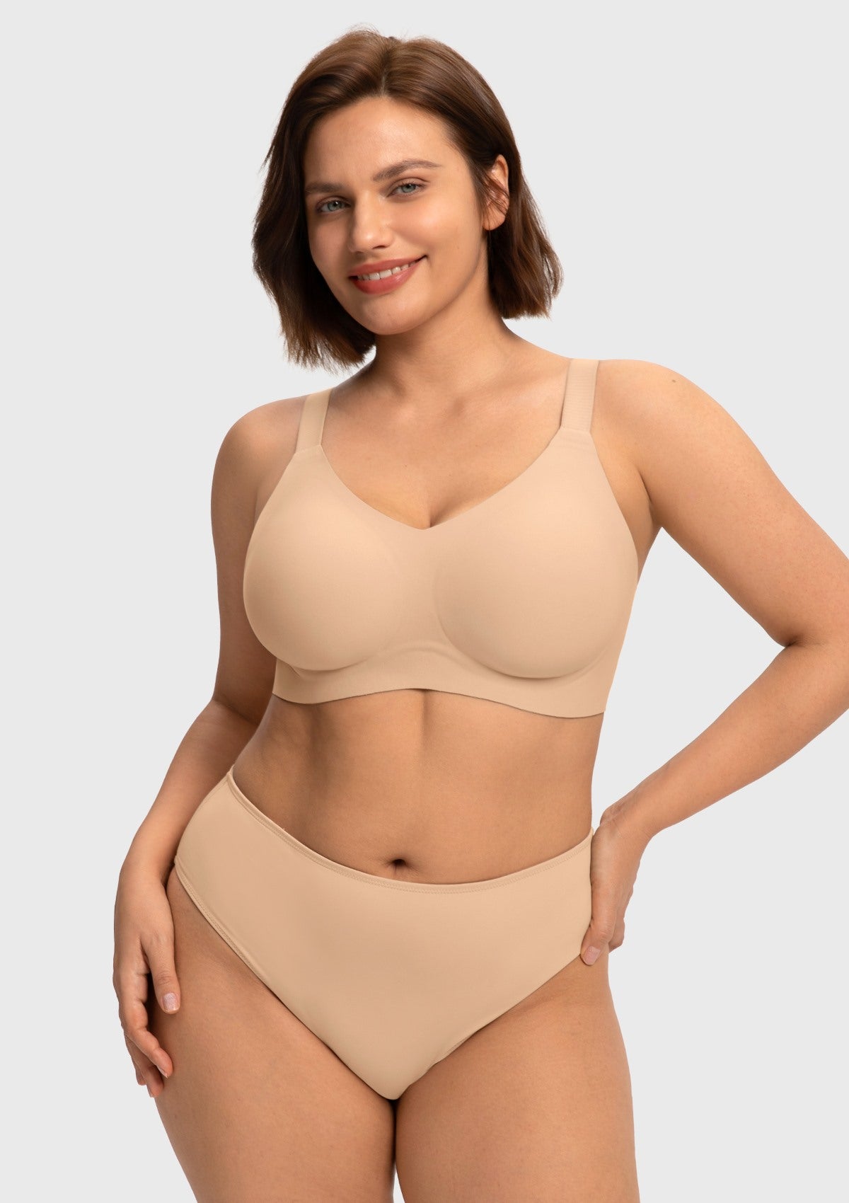 Confident model wearing the Light Beige full coverage wireless bra, featuring comfortable jelly support that naturally adapts to changing body shapes.