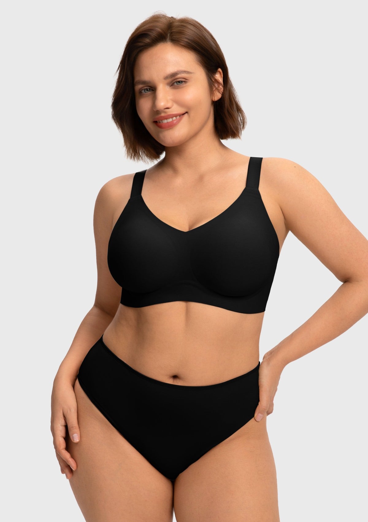 Front view of model wearing the HSIA black SoftTouch wireless jelly fit bra, featuring a sleek V-neckline and seamless everyday comfort for fuller figures.