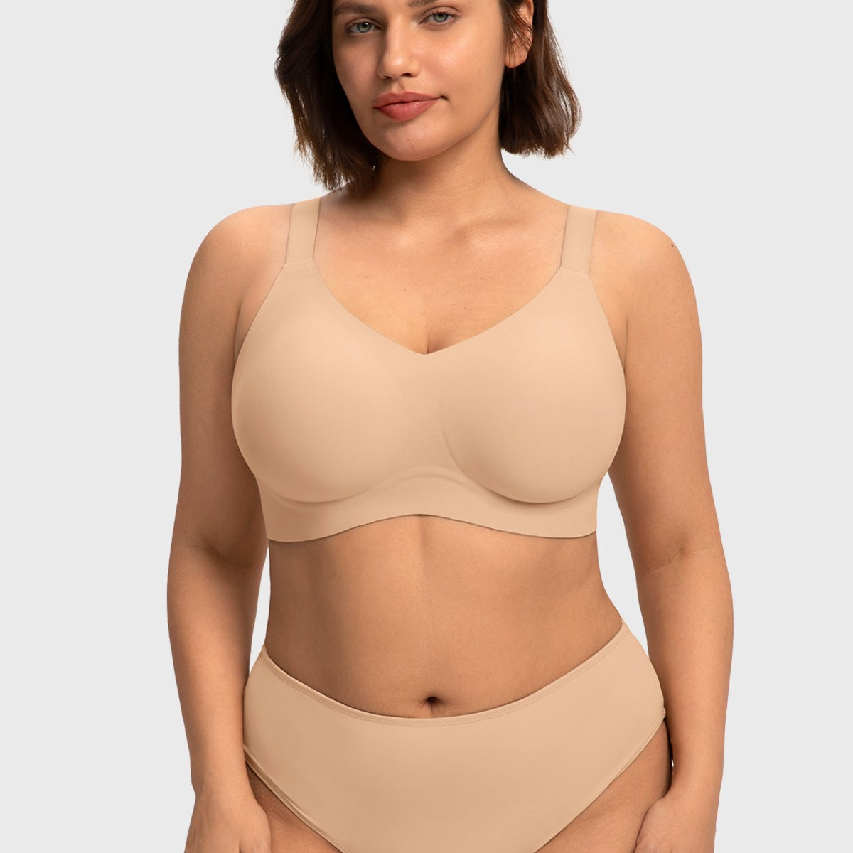 Front view of model in the Light Beige HSIA SoftTouch wireless bra, an invisible everyday foundation perfectly designed for a supportive everyday fit.