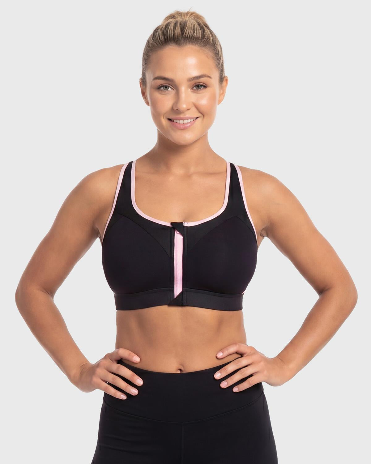 Front view of model in the classic Black HSIA Speed Race front closure sports bra, an effortless and supportive post surgery front zip bra for large busts.