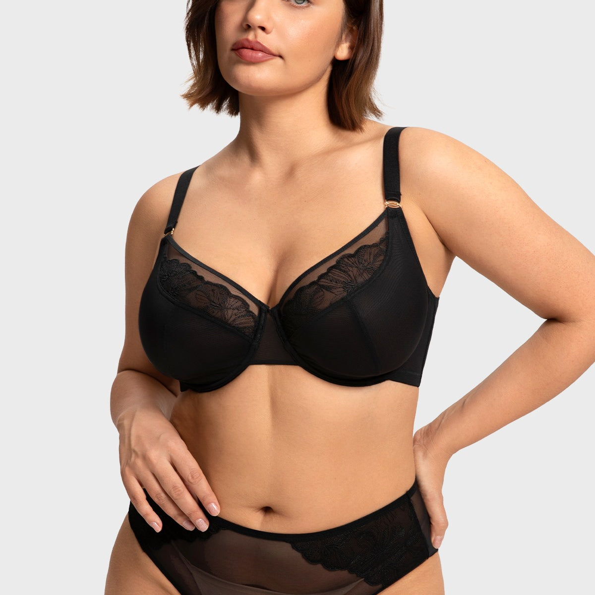 Front view of model in the black HSIA Yumi unlined bra, offering alluring sheer mesh with heavy-duty sculpting support for fuller figures.