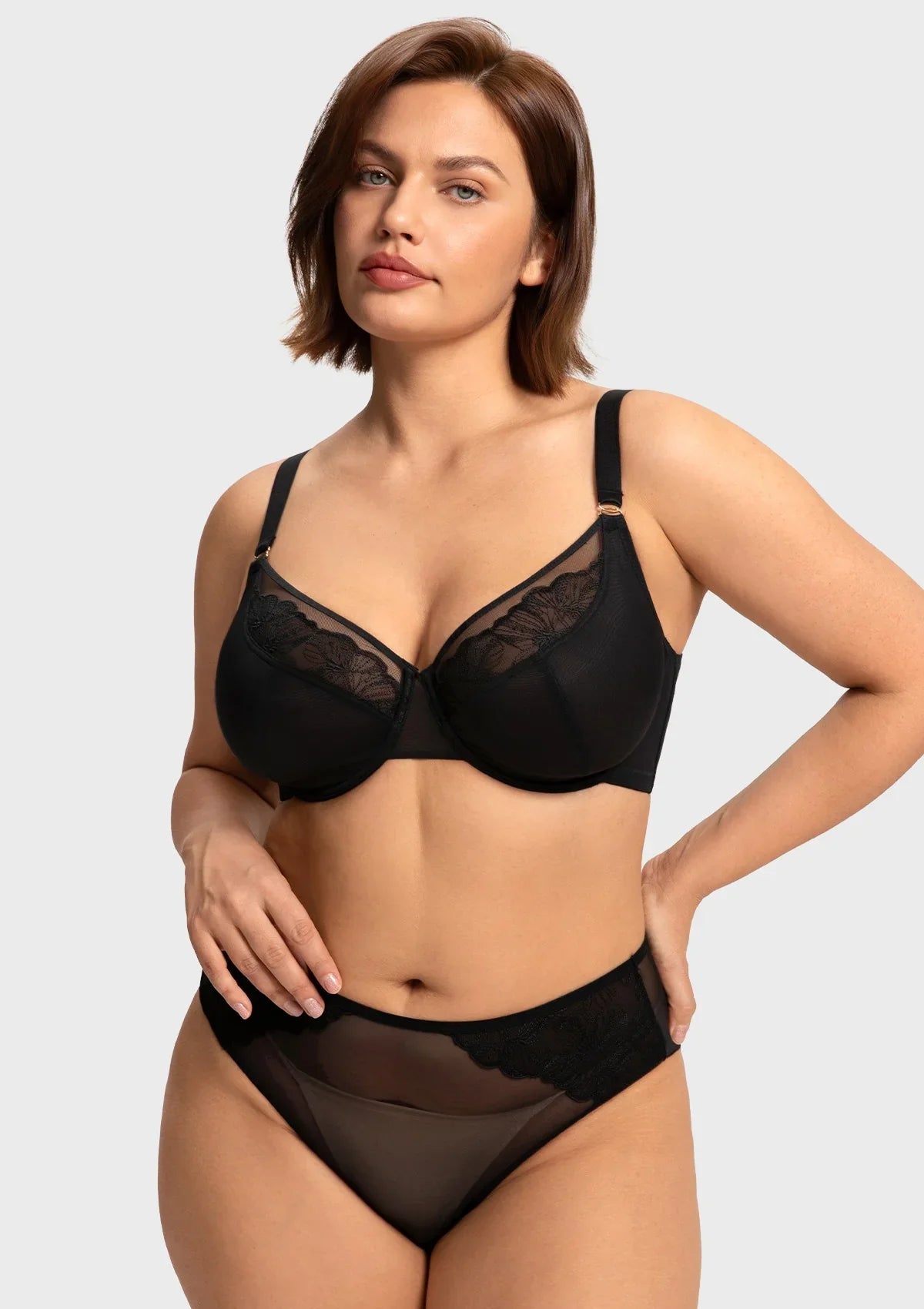 Front view of model in the black HSIA Yumi unlined bra, offering alluring sheer mesh with heavy-duty sculpting support for fuller figures.