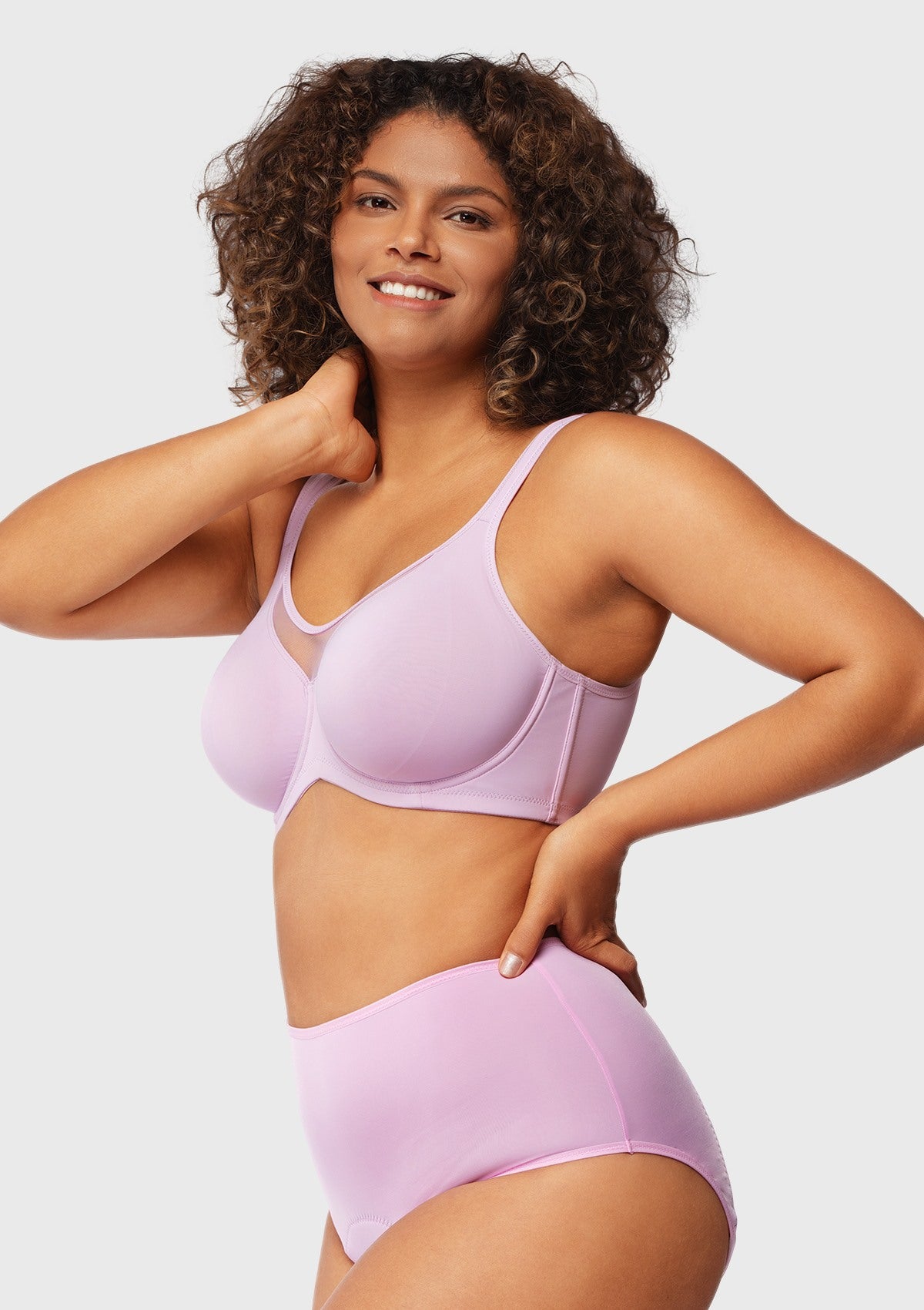Side view of the lavender seamless minimizer bra, highlighting the wide side wings that instantly smooth side rolls for a flawless look.