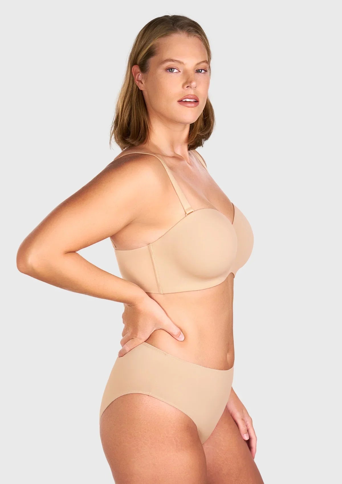 Side view of the comfortable black strapless bra with straps showing supportive shaping