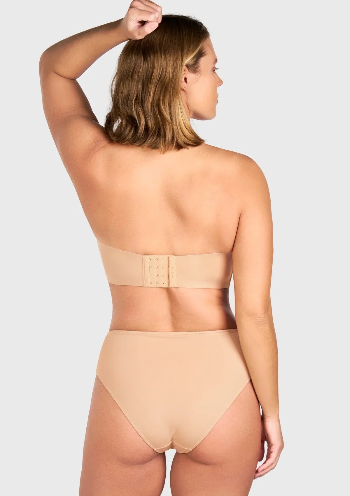 Back view highlighting the wide non-slip band on the black silicone-free strapless bra