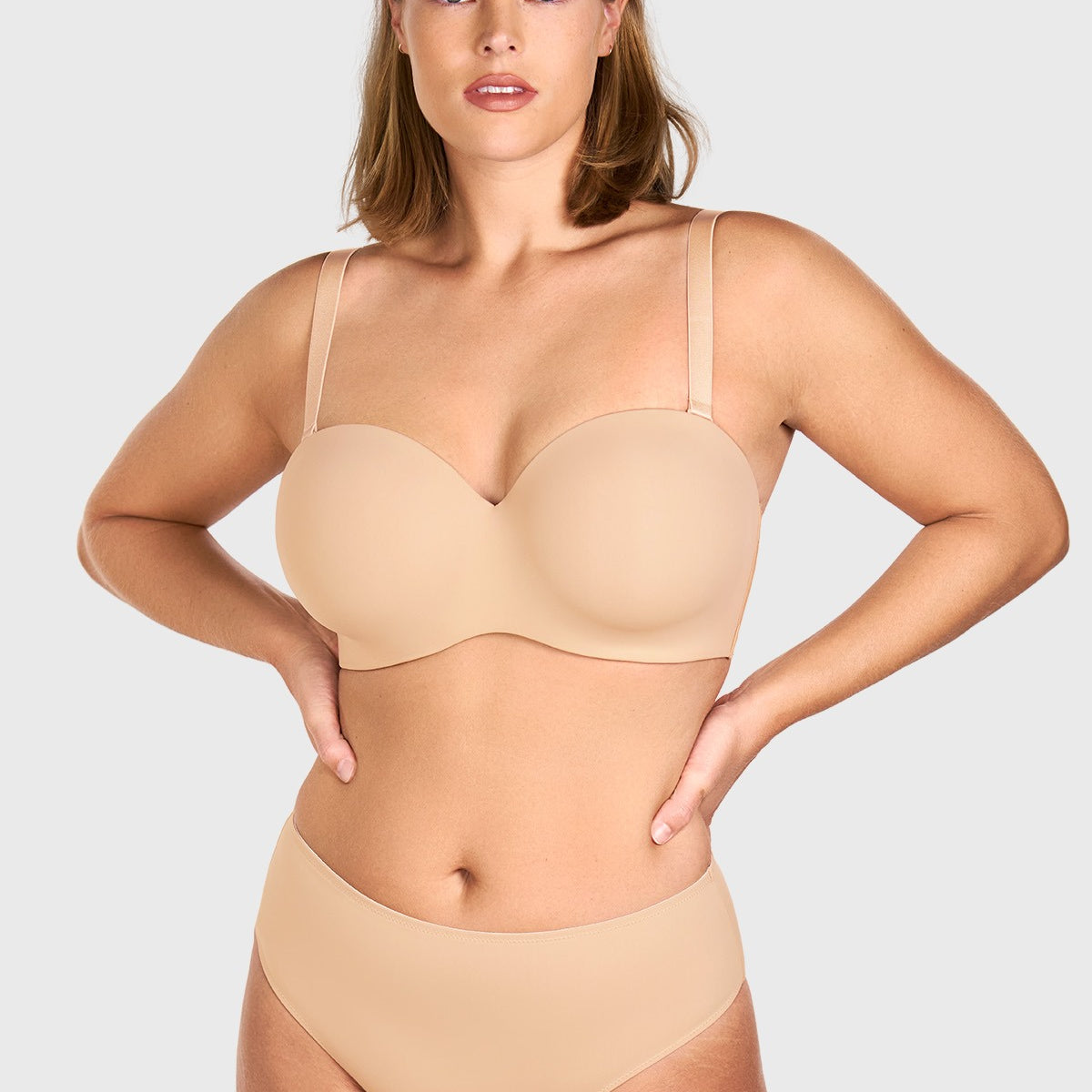 Front view of the black strapless bra worn with convertible straps for daily support