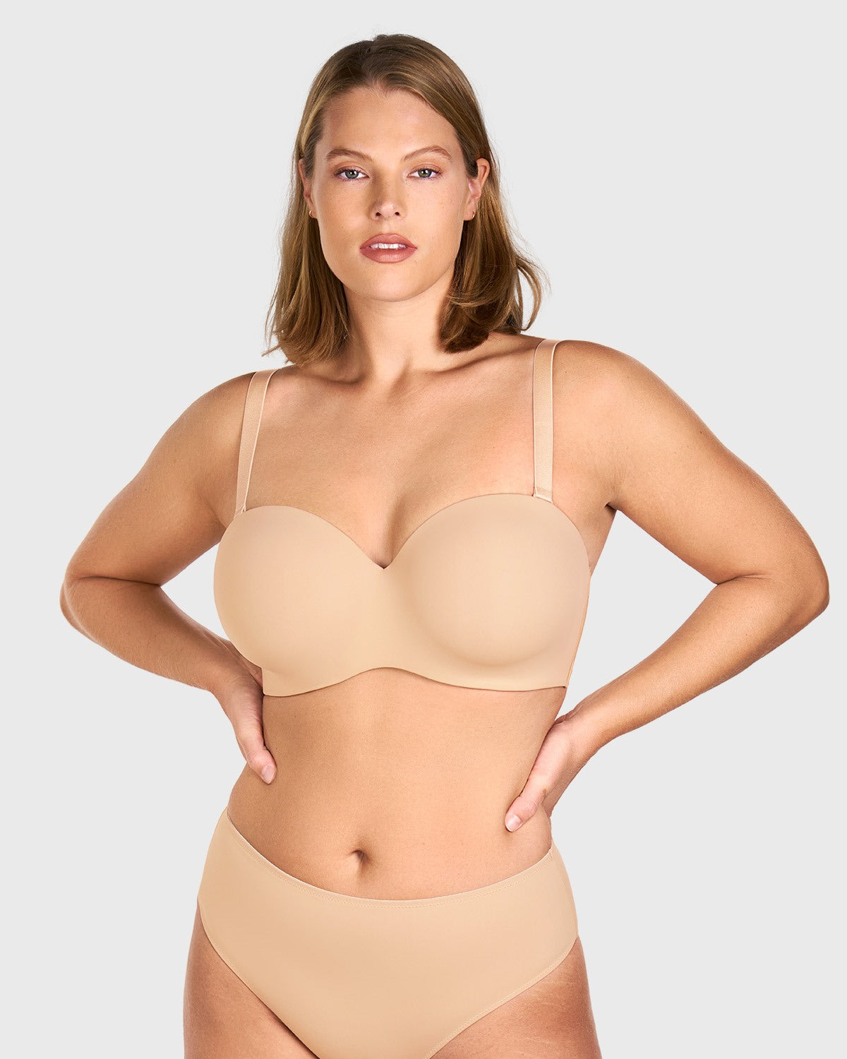 Front view of the black strapless bra worn with convertible straps for daily support