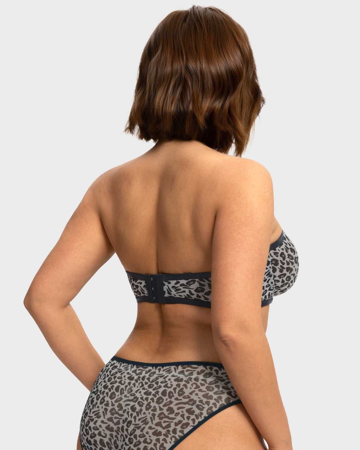 Back view highlighting the silicone no-slip grip of the black and white leopard minimizing bra strapless design
