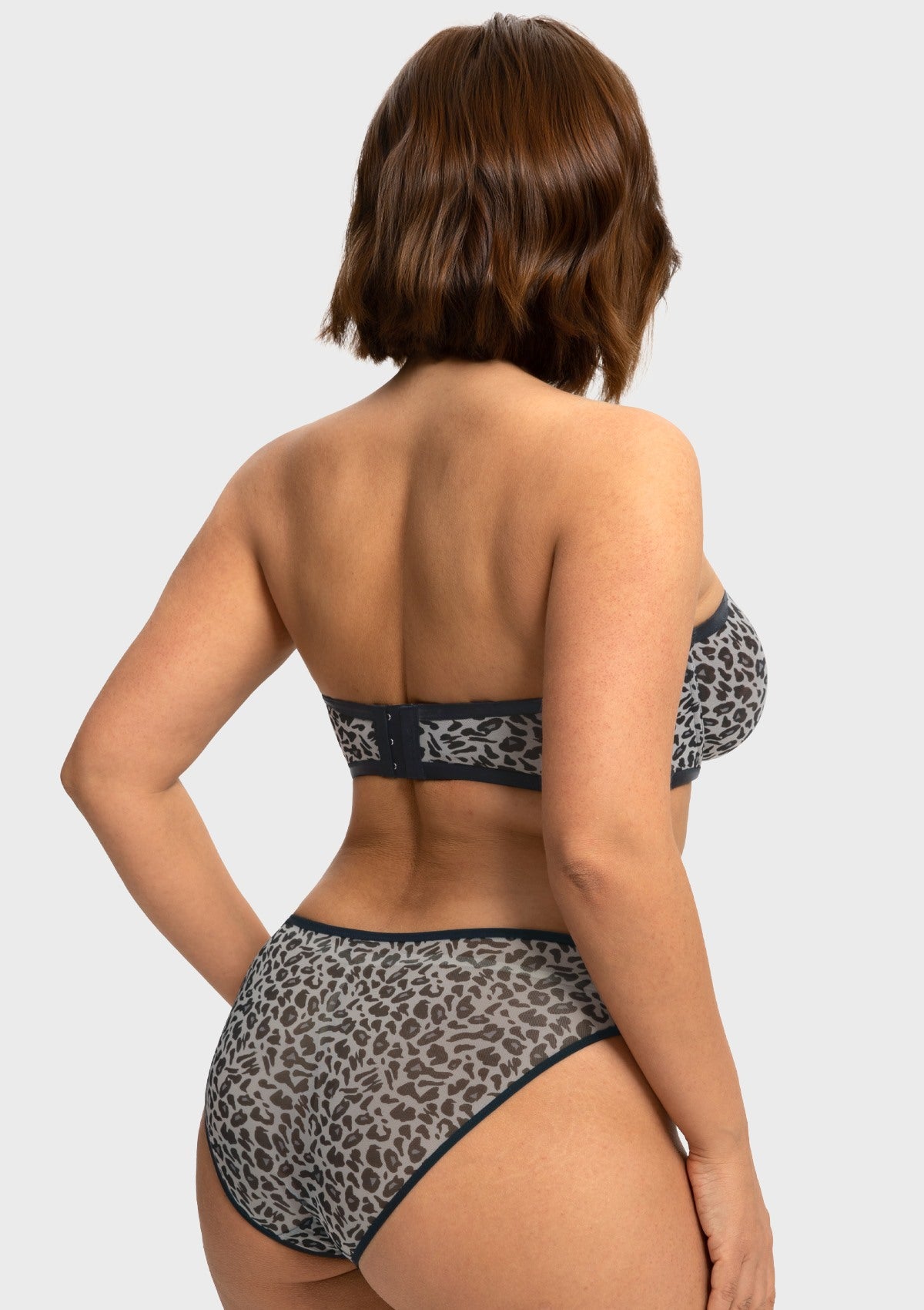 Back view highlighting the silicone no-slip grip of the black and white leopard minimizing bra strapless design