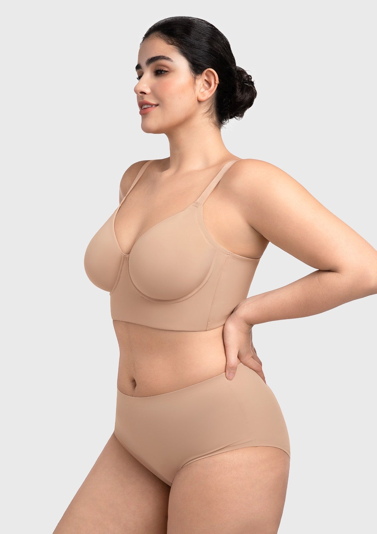 Three-quarter view of the nude underwire bra highlighting the side slings that gently prevent underarm spillover