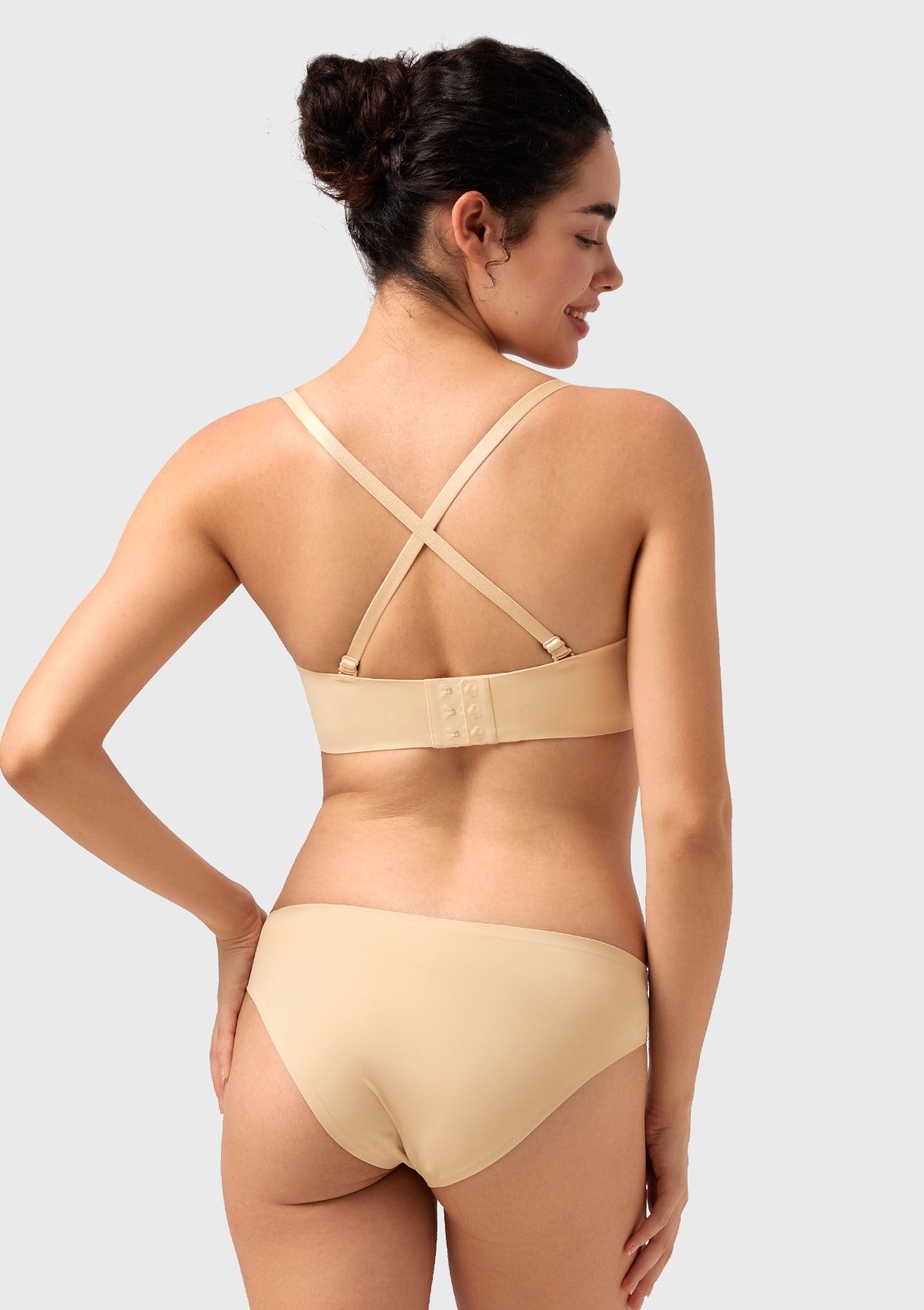 Rear view showcasing the nude multiway bra with straps in a crisscross style, ideal for racerback tanks and enhanced, secure support.