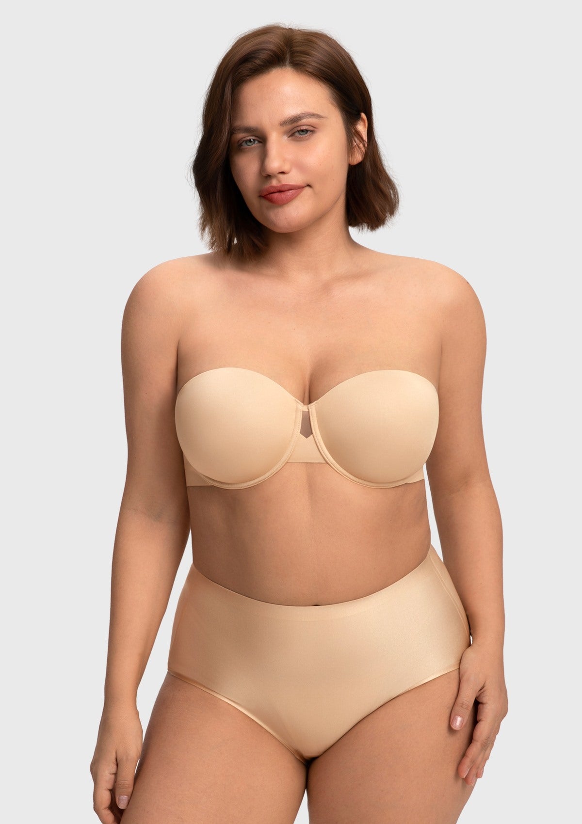 Front view of the nude seamless strapless bra, providing the perfect invisible foundation and reliable lift for a heavy bust.
