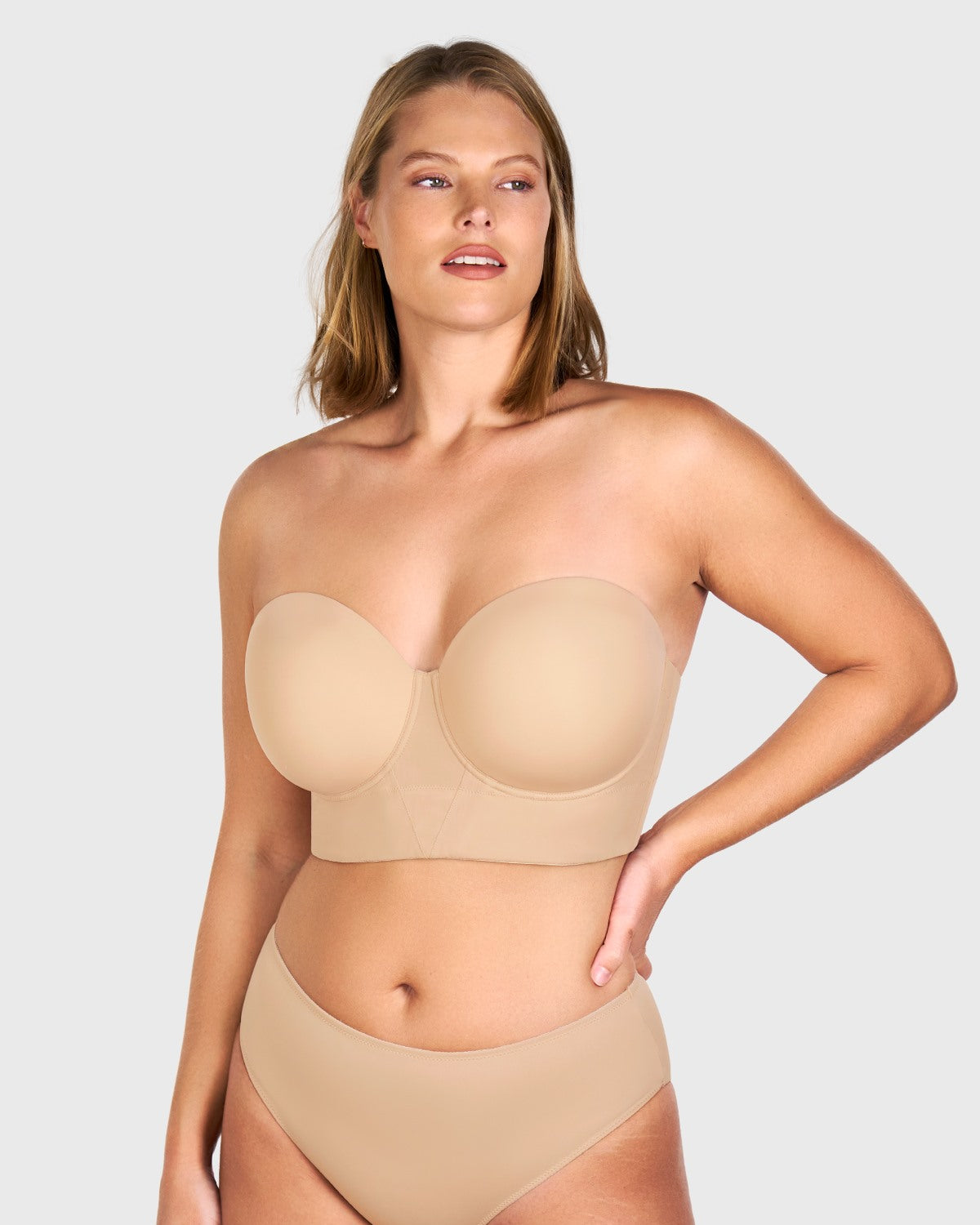 Front view of the light nude seamless strapless bra, effortlessly disappearing under tight-fitting or light-colored clothing.
