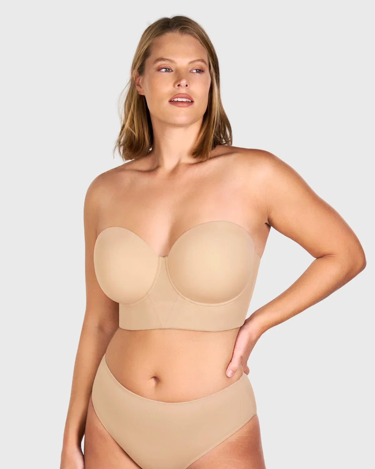 Front view of the light nude seamless strapless bra, effortlessly disappearing under tight-fitting or light-colored clothing.