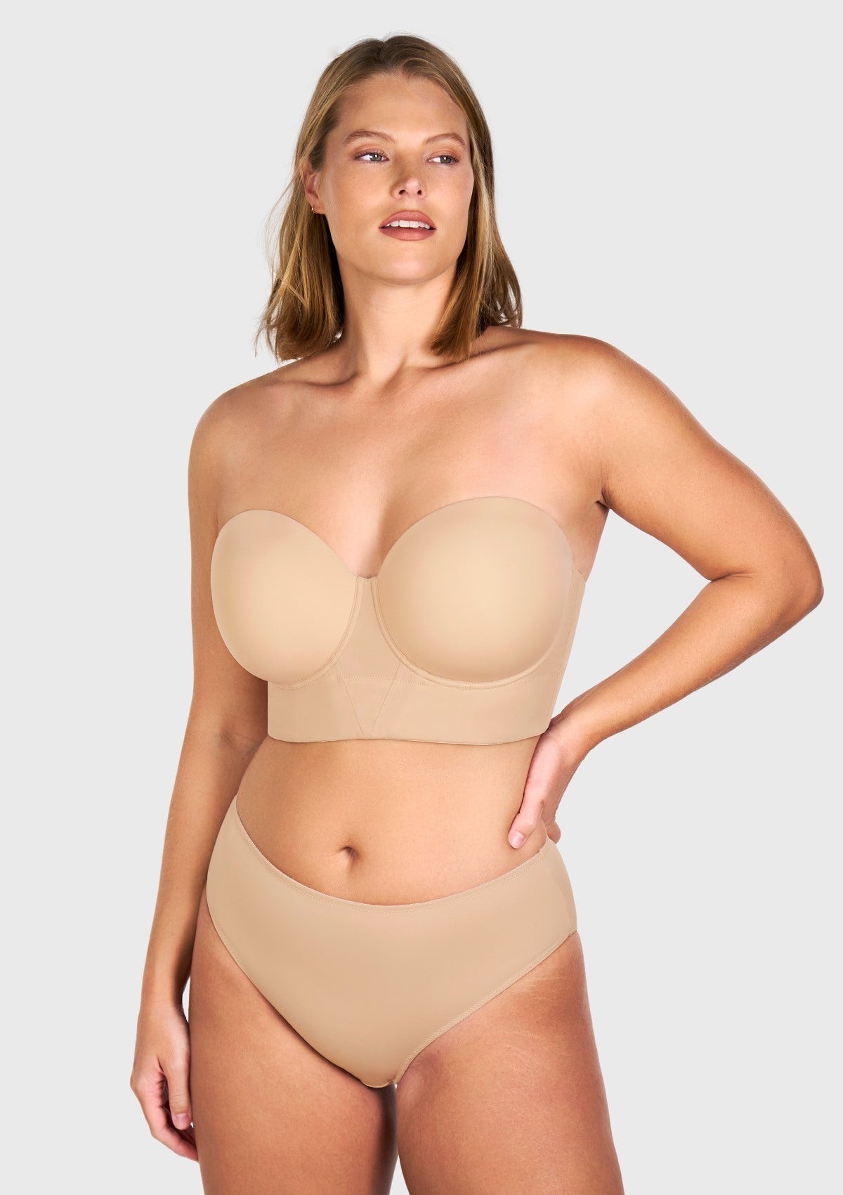 Front view of the light nude seamless strapless bra, effortlessly disappearing under tight-fitting or light-colored clothing.