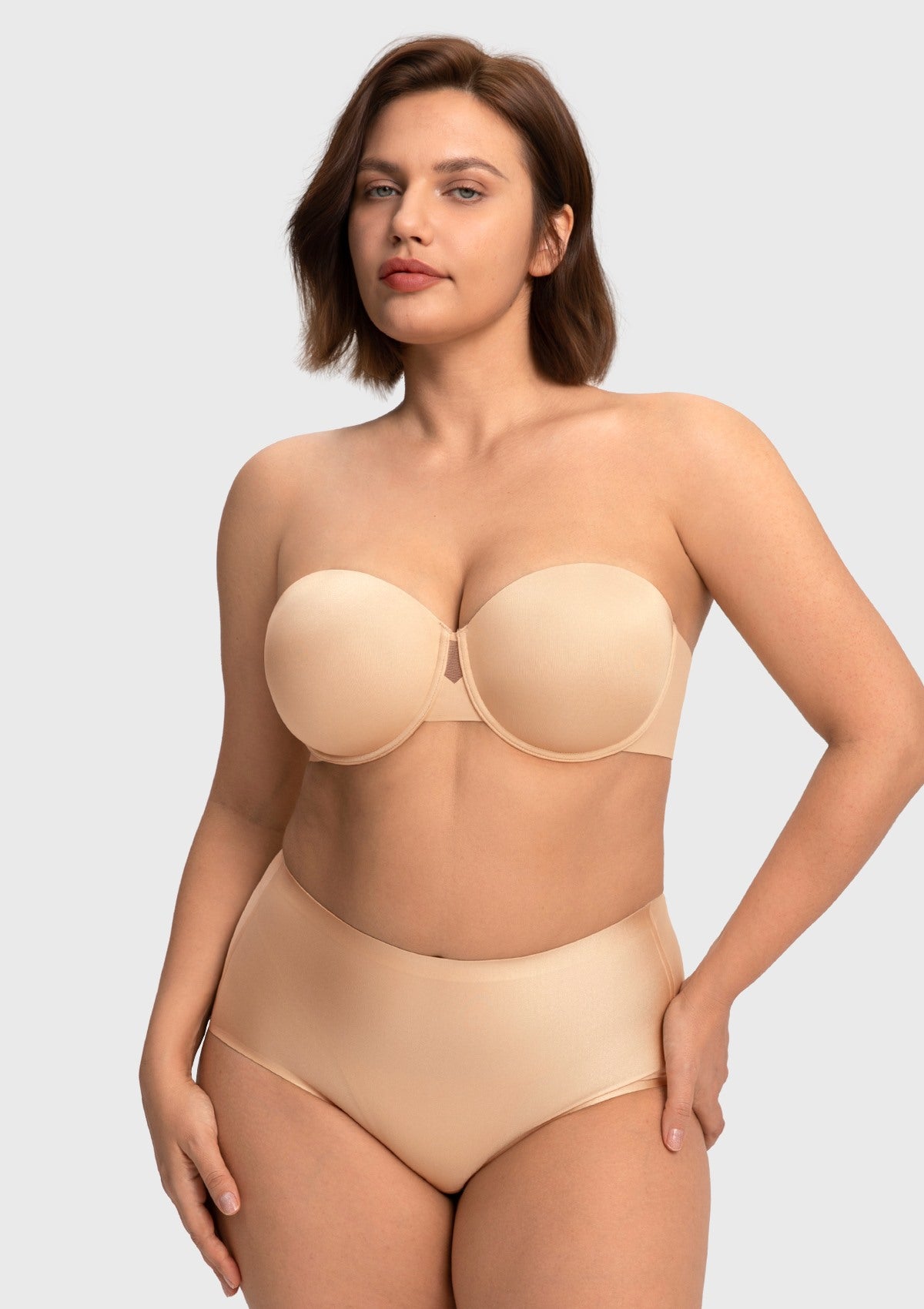 Woman posing confidently in the nude strapless bra for a large chest, designed for breathable, all-day wear without digging or pinching.