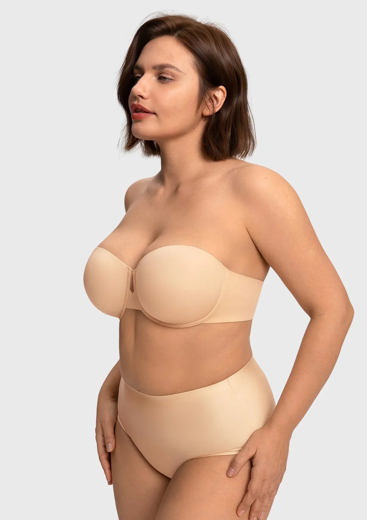 Three-quarter side view of the nude underwire half-cup strapless bra, highlighting the flattering contour and lightweight lift.