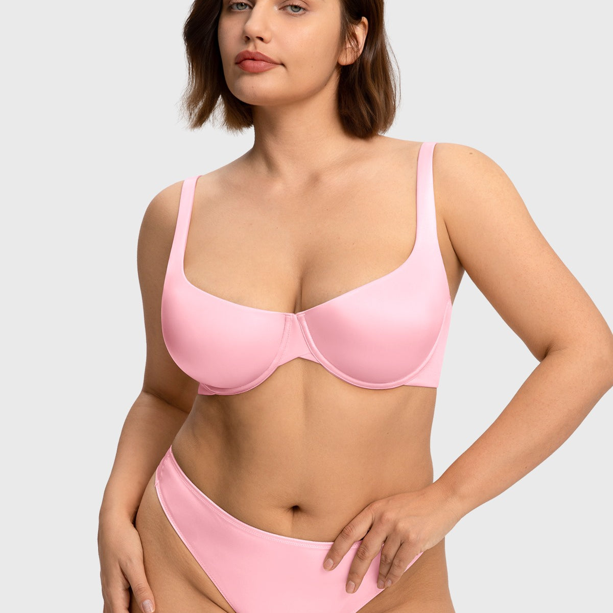 Front view of the Victoria pink romantic satin T-shirt bra, offering a beautiful, natural shape and completely invisible look under tight tops.