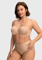 A woman stretching her arms in the almond skin stay-put strapless bra, enjoying restriction-free movement and secure containment.