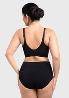 Back view of the black seamless minimizer demonstrating a flawless, back-smoothing silhouette with wide wings