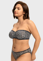 Side profile demonstrating lift and support of the black and white leopard strapless bra for large breasts
