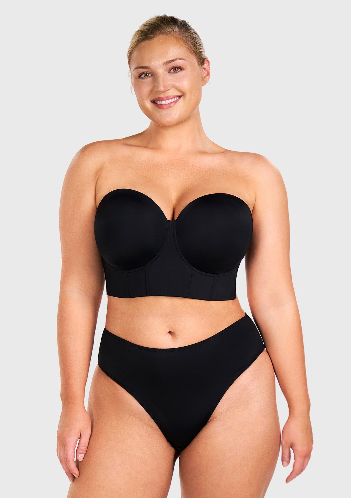 Front view of the black strapless bra, serving as the perfect elegant bra for off the shoulder dress and evening wear.