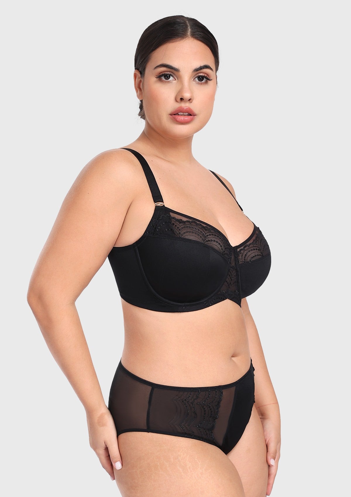 Three-quarter side profile of the black plus size balconette bra, expertly designed with multi-part cups to naturally center and shape heavy breasts.