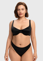 Front view of the black invisible unlined T-shirt bra, delivering an effortless second-skin feel and sleek support for A to DDD cups.